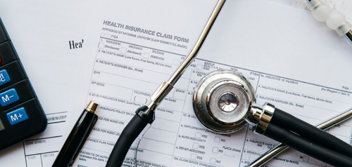 Staff member preparing a medical report document at Gosford Doctors