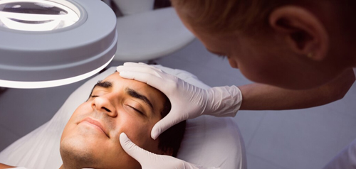 Clinician performing a minor skin procedure at Gosford Doctors