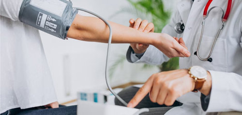 Occupational health nurse conducting a workplace medical exam at Gosford Doctors