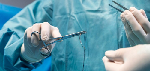 Surgeon performing a small‑scale procedure at Gosford Doctors