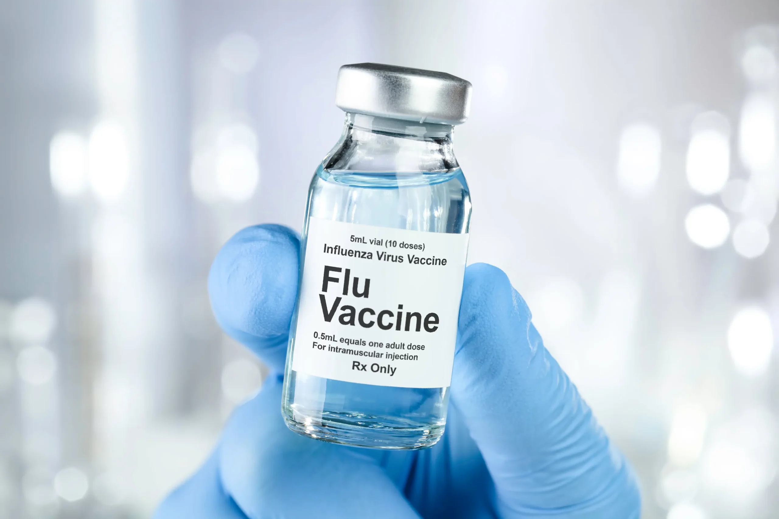 Pharmacist or nurse giving a seasonal flu vaccine at Gosford Doctors